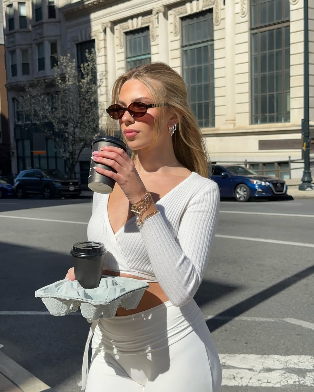 Nika taking a coffee break on a city street