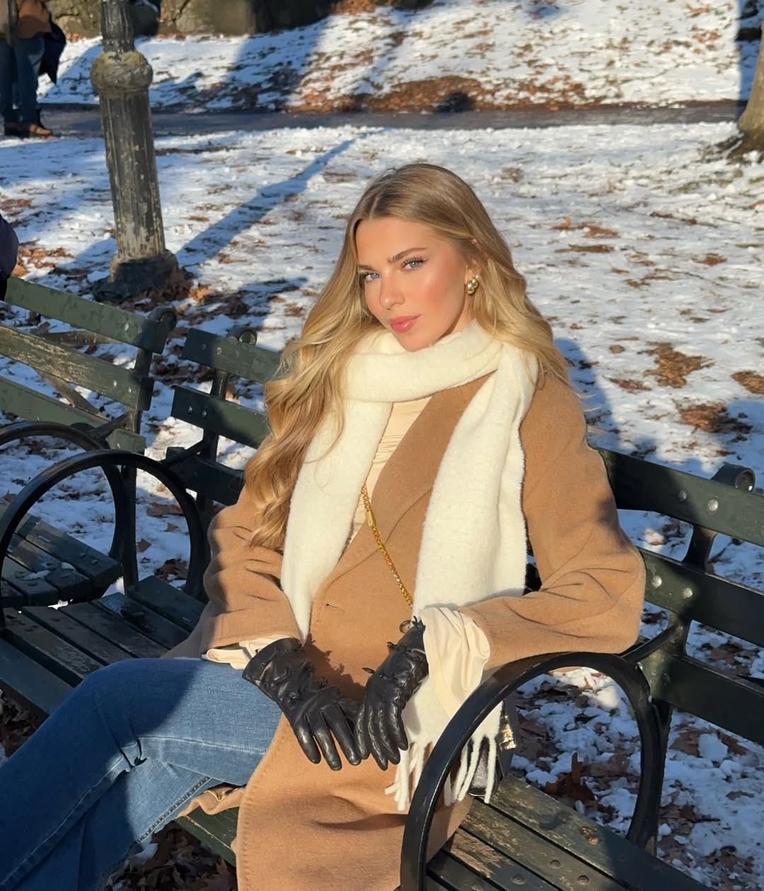 Nika on a snowy park bench in New York City